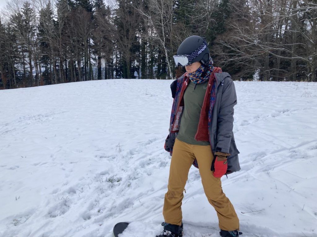 Muntagnard MIUtec Midlayer mit 1/2 Zip beim Snowboarden in den Bergen